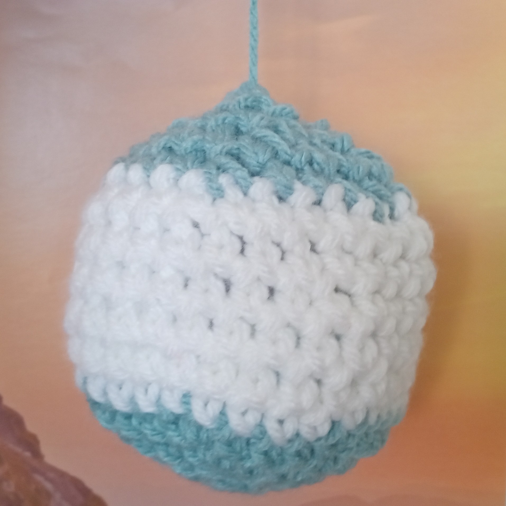 The completed planet with blue and white stripes